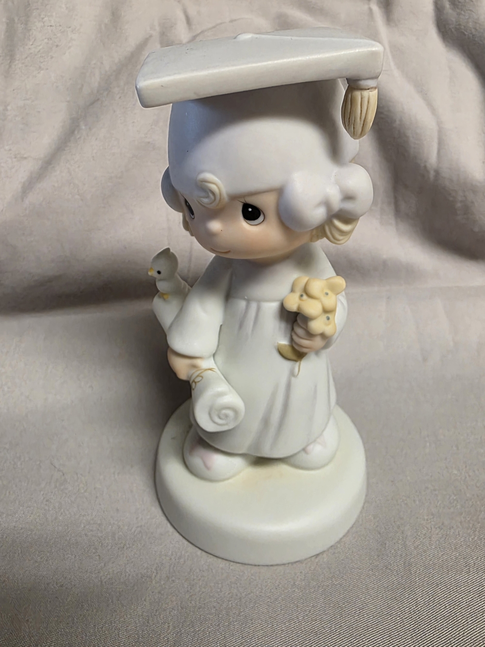 Vintage 1980 Precious Moments "The Lord Bless You and Keep You" figurine.